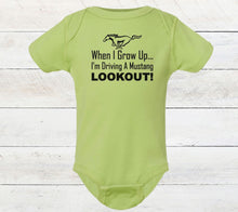 Load image into Gallery viewer, Green baby bodysuit with text and Mustang logo on a wooden surface