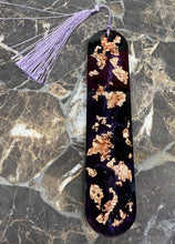 Load image into Gallery viewer, Decorative bookmark with gold leaf and purple tassel on a marble surface