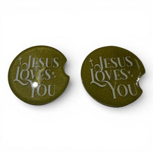 Load image into Gallery viewer, Two green car coasters with 'Jesus Loves You' text on a white background