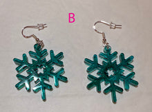 Load image into Gallery viewer, Teal snowflake earrings on a light gray background