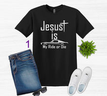 Load image into Gallery viewer, Black t-shirt with 'Jesus is my ride or die' text, paired with jeans, sneakers, and sunglasses on a white background.