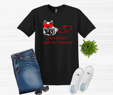 Load image into Gallery viewer, Black t-shirt with a graphic design, blue jeans, white sneakers, and sunglasses on a white background.