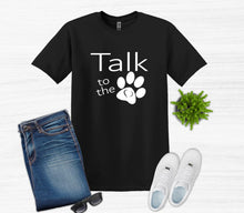 Load image into Gallery viewer, Black t-shirt with 'Talk to the Paw' design, blue jeans, white sneakers, and sunglasses on a white background.