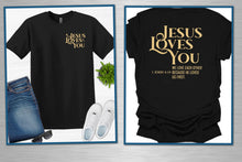 Load image into Gallery viewer, Black t-shirt with 'Jesus Loves You' text, jeans, and white sneakers on a light gray background.