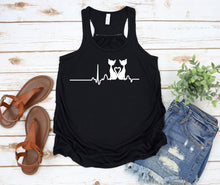 Load image into Gallery viewer, Black tank top with a heart rate design featuring a cat, sandals, and denim shorts on a wooden surface.