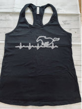 Load image into Gallery viewer, Black tank top with a white graphic design on a wooden surface