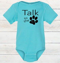 Load image into Gallery viewer, Turquoise baby onesie with 'Talk to the Paw' text on a wooden surface