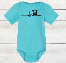 Load image into Gallery viewer, light blue baby bodysuit with a black cat graphic design on a wooden surface