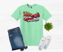 Load image into Gallery viewer, A mint green graphic t-shirt featuring a 'Merry Stangmas' Santa Claus in a red muscle car with reindeer design, styled in a flat lay with blue jeans, white sneakers, sunglasses, and a small green plant on a white wood background.