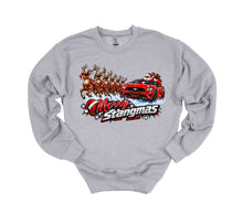 Load image into Gallery viewer, A light gray crewneck sweatshirt featuring a colorful graphic print of Santa Claus driving a red race car pulled by reindeer, with the text 'Merry Stangmas' underneath.