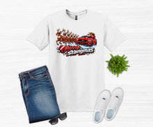 Load image into Gallery viewer, A white graphic t-shirt featuring a red race car with reindeer and the text 'Merry Stangmas' in stylized lettering. The t-shirt is styled in a flat lay with blue jeans, white sneakers, sunglasses, and a small green plant on a light gray wood-textured background.
