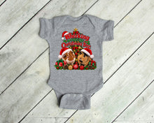Load image into Gallery viewer, A heather gray baby bodysuit with a festive Christmas graphic featuring two guinea pigs in Santa hats and the text 'Wheeking Around the Christmas Tree', laid flat on a light gray wood plank background.