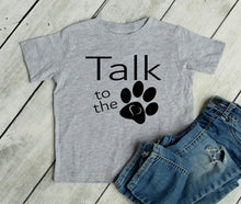 Load image into Gallery viewer, Gray t-shirt with 'Talk to the paw' text and black paw print on a wooden surface with denim shorts.