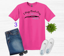 Load image into Gallery viewer, Pink t-shirt with text and graphic, blue jeans, white sneakers, and sunglasses on a light gray background.