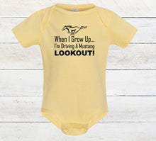 Load image into Gallery viewer, Yellow baby bodysuit with text and horse graphic on a wooden surface