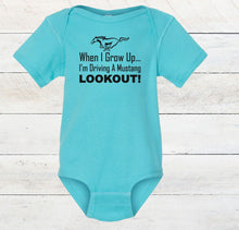Load image into Gallery viewer, Turquoise baby bodysuit with text and Mustang logo on a wooden surface
