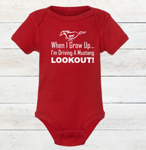 Load image into Gallery viewer, Red baby bodysuit with white text and Mustang logo on a wooden surface
