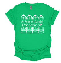 Load image into Gallery viewer, A bright green short-sleeve t-shirt with a white graphic print on the front reading 'St. Frances Cabrini Preschool' with schoolhouse illustrations above and below the text, shown on a plain white background.