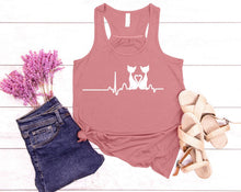 Load image into Gallery viewer, Pink tank top with cat and heart design, paired with jeans and sandals on a wooden surface.