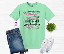 Load image into Gallery viewer, Mint green t-shirt with Forget the Carriage this Princess rides in her Mom's Mustang text, blue jeans, white sneakers, and sunglasses on a light gray background.
