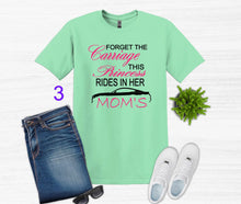 Load image into Gallery viewer, Mint green t-shirt with Forget the Carriage this Princess rides in her Mom's Mustang text, paired with jeans, sneakers, and sunglasses on a white background.