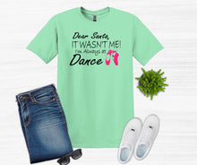 Load image into Gallery viewer, Green t-shirt with text, jeans, sneakers, and sunglasses on a white background