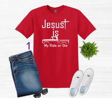 Load image into Gallery viewer, Red t-shirt with 'Jesus is my ride or die' text, jeans, sneakers, and sunglasses on a white background.