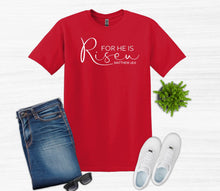 Load image into Gallery viewer, Red t-shirt with 'For He is Risen' text, jeans, white sneakers, and sunglasses on a white background