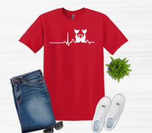 Load image into Gallery viewer, Red t-shirt with a white cat graphic, blue jeans, white sneakers, and sunglasses on a light gray background.