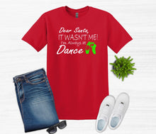 Load image into Gallery viewer, Red t-shirt with humorous text, blue jeans, white sneakers, and sunglasses on a light gray background.