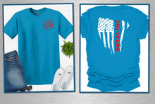 Load image into Gallery viewer, Two blue t-shirts with American flag designs on a white background