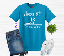 Load image into Gallery viewer, Blue t-shirt with 'Jesus is My Ride or Die' text, jeans, white sneakers, and sunglasses on a light gray background.