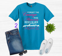 Load image into Gallery viewer, Blue t-shirt with Forget the Carriage this Princess rides in her Mom's Mustang text, jeans, white sneakers, and sunglasses on a light gray background.