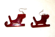 Load image into Gallery viewer, Red sleigh shaped earrings on a white background