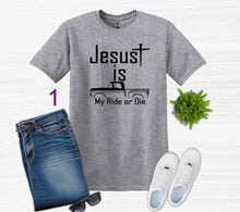 Load image into Gallery viewer, Gray t-shirt with 'Jesus is my ride or die' text, paired with jeans, sneakers, and sunglasses on a white background.