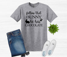 Load image into Gallery viewer, Gray t-shirt with text, blue jeans, white sneakers, sunglasses, and a plant on a white background