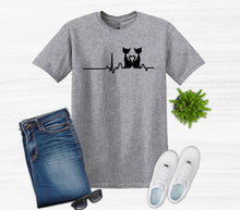 Load image into Gallery viewer, Gray t-shirt with a cat graphic design, blue jeans, white sneakers, and sunglasses on a white background.