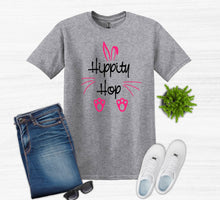 Load image into Gallery viewer, Gray t-shirt with 'Hippity Hop' design, blue jeans, white sneakers, sunglasses, and a plant on a white background
