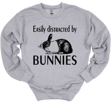 Load image into Gallery viewer, Gray sweatshirt with a graphic of a rabbit and text 'Easily distracted by Bunnies' on a white background