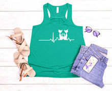 Load image into Gallery viewer, Green tank top with cat design, sandals, sunglasses, and jeans on a wooden floor.