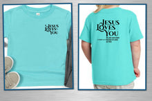 Load image into Gallery viewer, T-shirt with 'Jesus Loves You' text on front and back, displayed on a person.