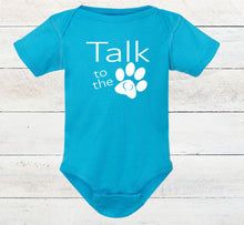 Load image into Gallery viewer, Blue baby onesie with 'Talk to the paw' text on a wooden surface