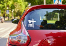 Load image into Gallery viewer, Red car with white I can't but I know a guy cross decal on the back window.