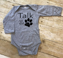 Load image into Gallery viewer, Gray baby onesie with 'Talk to the Paw' text on a wooden surface