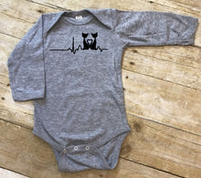 Load image into Gallery viewer, Gray baby bodysuit with a black cat design on a wooden surface