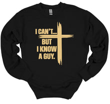 Load image into Gallery viewer, Black sweatshirt with gold I can't but I know a guy text and cross design on a white background