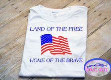 Load image into Gallery viewer, White toddler T-shirt with 'LAND OF THE FREE HOME OF THE BRAVE' text and an American flag design.