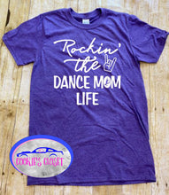 Load image into Gallery viewer, A purple adult t-shirt with the phrase 'Rockin' the DANCE MOM LIFE' printed in white.
